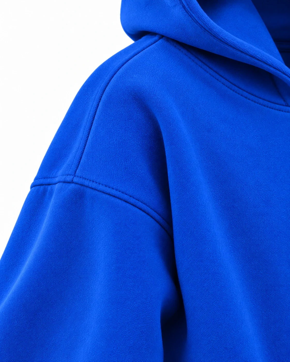Drop shoulder — royal blue hoodie fabric close-up